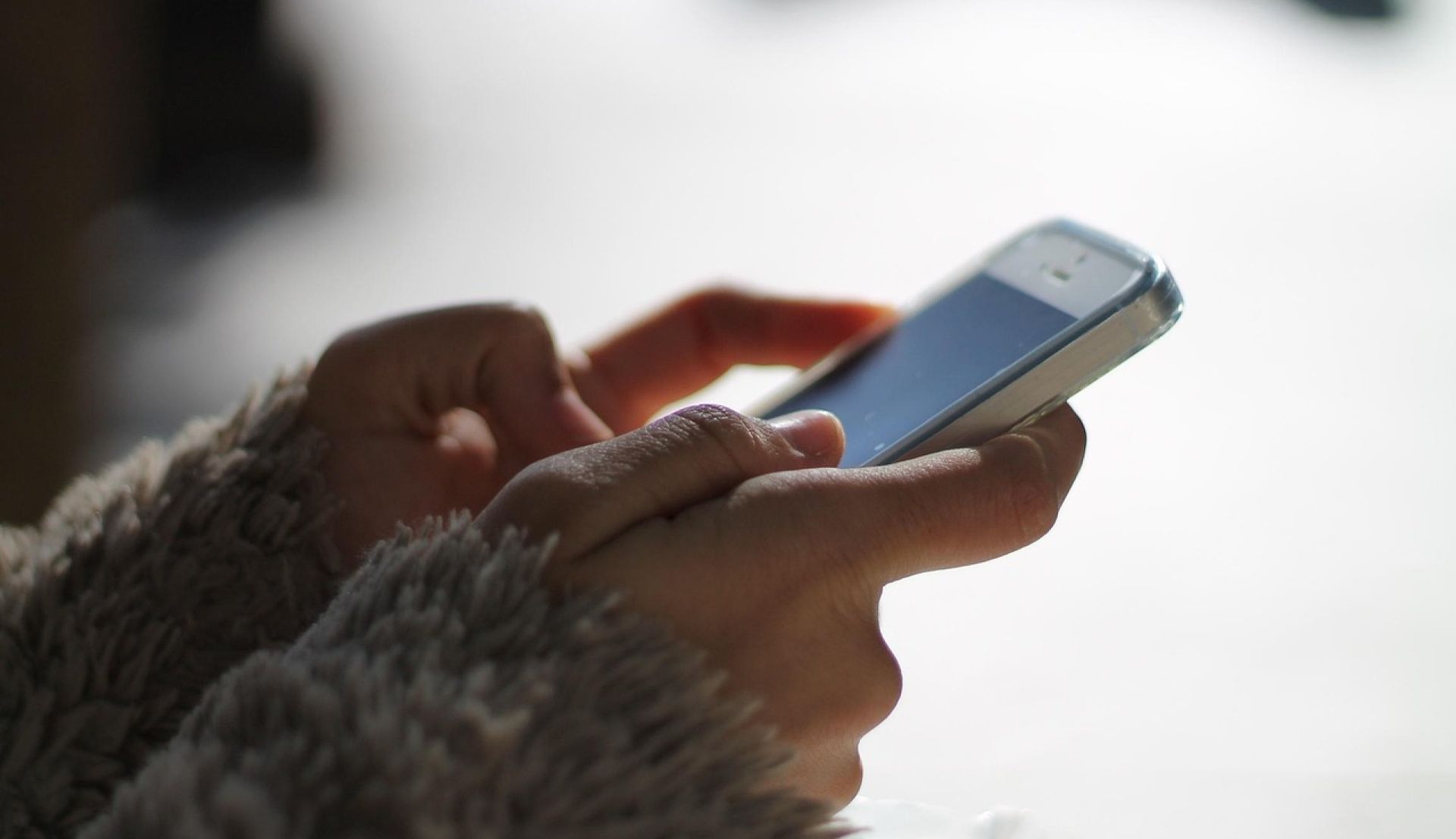 Close-up of hands holding a smartphone
